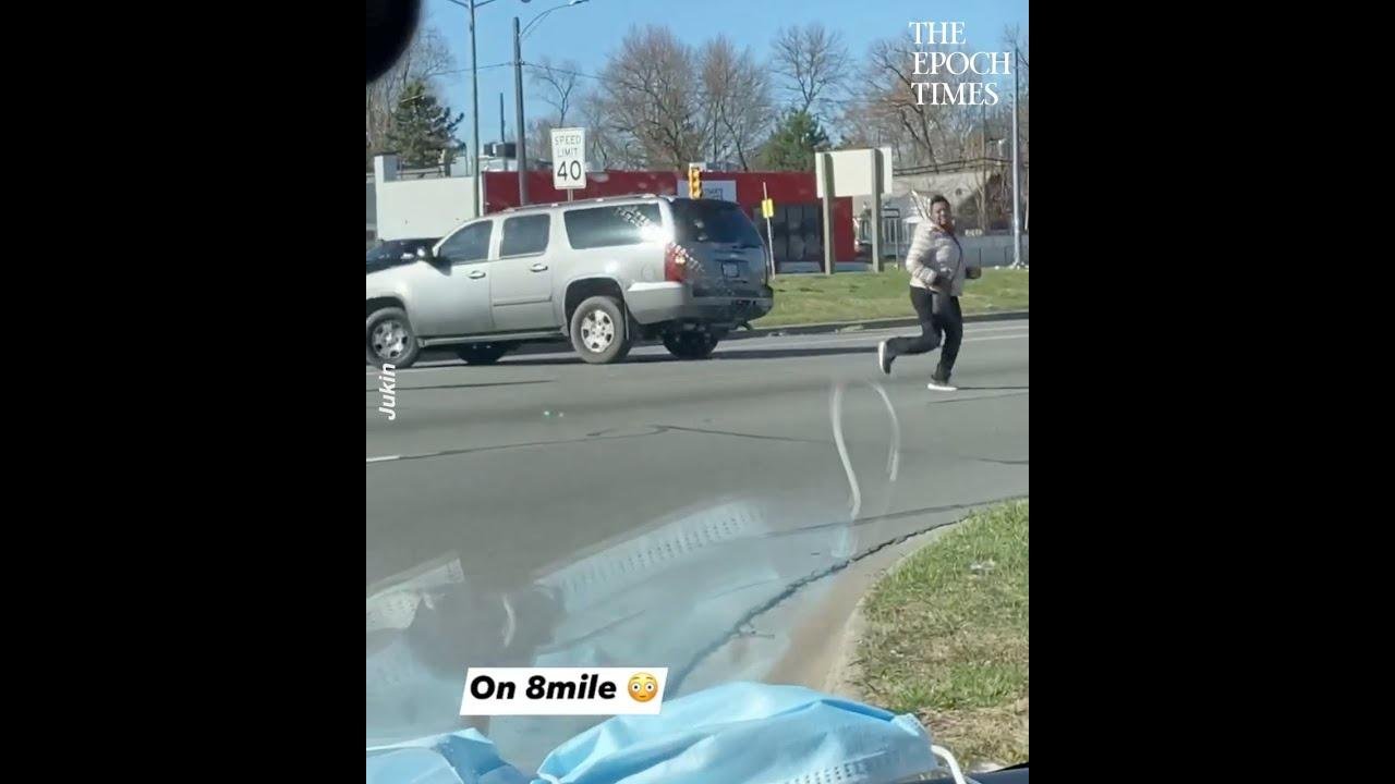 Woman Locked Out of Her Car Chases It While It Spins on the Road in Reverse