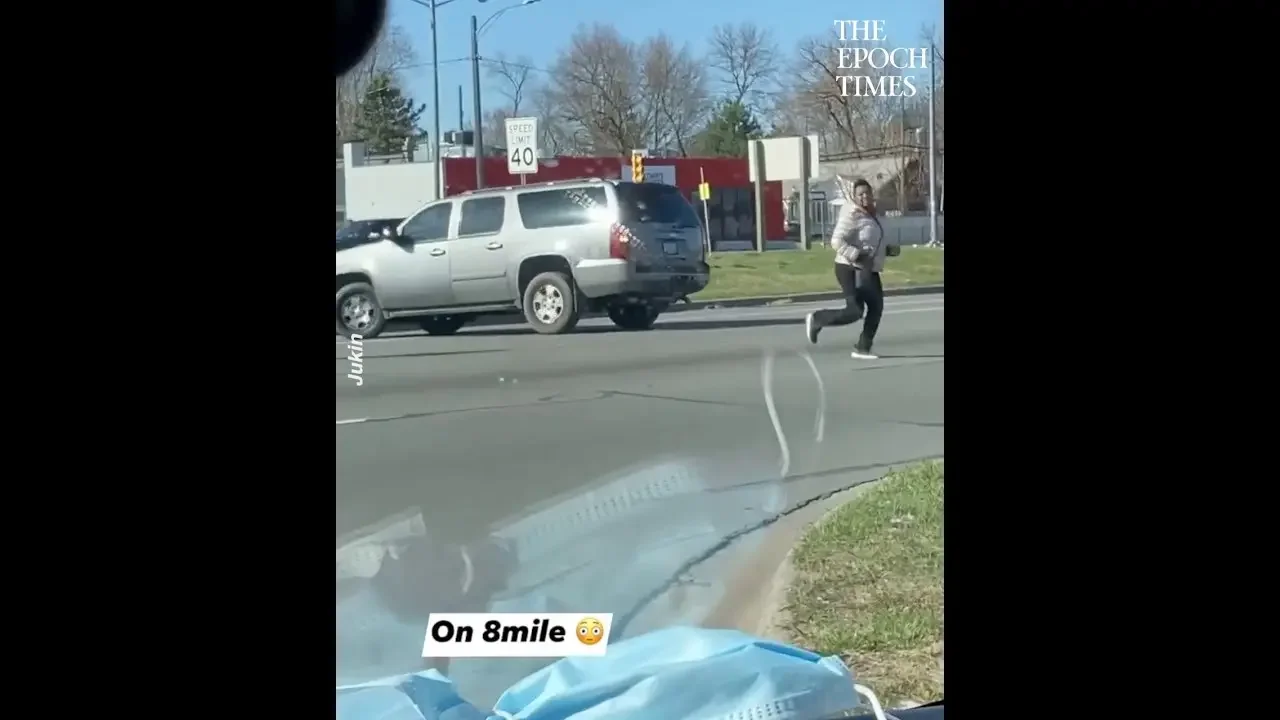 Woman Locked Out of Her Car Chases It While It Spins on the Road in Reverse