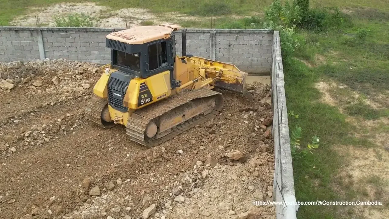 esp1.dozer dr51px Komatsu pushing stone soil delete pond with 5t dump trucks build house development