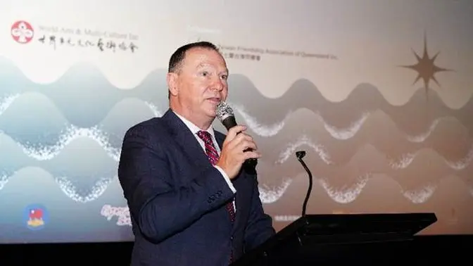 A person speaking into a microphone

AI-generated content may be incorrect.